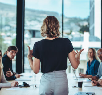 Businesswoman sharing new ideas in meeting